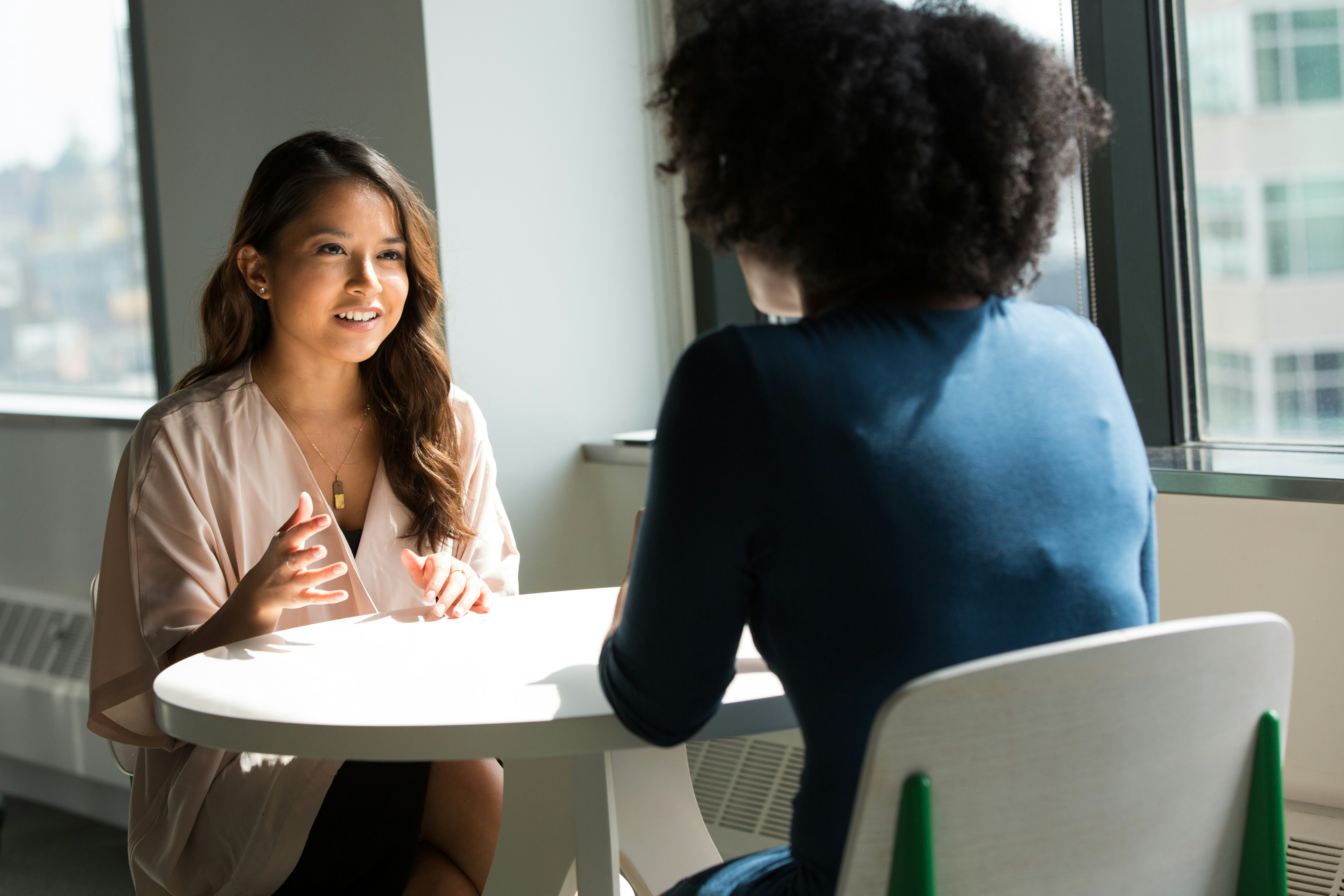 Two women in professional conversation